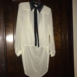 Sheer shirt with black lace collar.